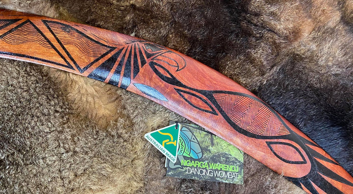 X-Large Bundjil the Wedge Tailed Eagle Wangim / Boomerang. Made from Redgum timber. Hand Crafted in Australia. All artefacts come with an information card. The card has information about the artist, artefact and design. All our wangim are made from timber collected from tree roots or branches that have a natural bend. All designs are based on traditional symbols from South East Australia