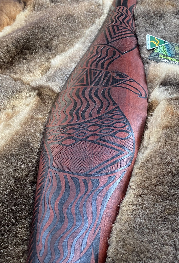 Parrying Malgarr - Large Wide with Bunjil the Wedge Tailed Eagle Design. Traditionally malgarr ( shields ) were used with liyangayil (fighting clubs) for hand to hand combat with our enemies. I have replicated the shape of these shields in my artwork. Hand crafted in Australia from Australian Red Cedar timber. All artefacts come with an information card. The card has information about the artist, artefact and design. All designs are based on traditional Aboriginal symbols from South East Australia.