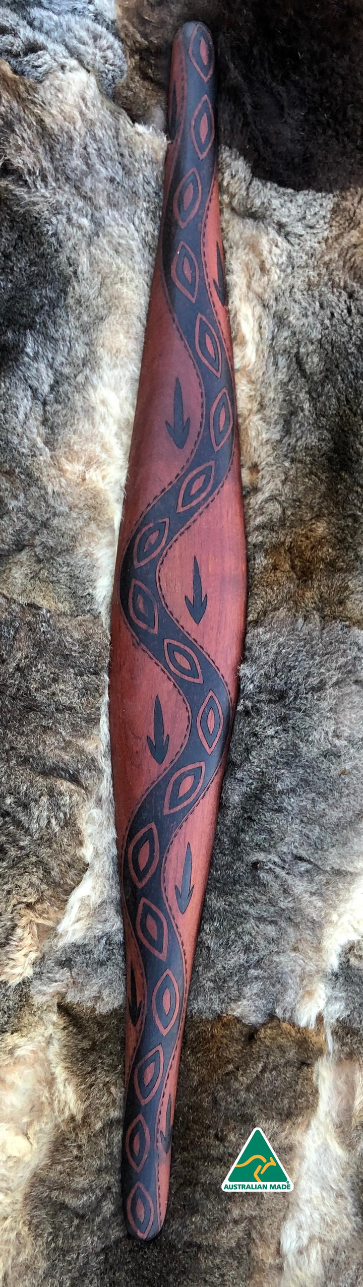 Traditionally malgarr ( shields ) were used with liyangayil (fighting clubs) for hand to hand combat with our enemies. I have replicated the shape of these shields in my artwork. Barring is a track that our old people used for walking to a different country. They also used tracks as part of complex trade route system. Animals also have their own tracks, which we use to warranwgan ( hunt ) them. Hand crafted in Australia from Australian Red Cedar timber.