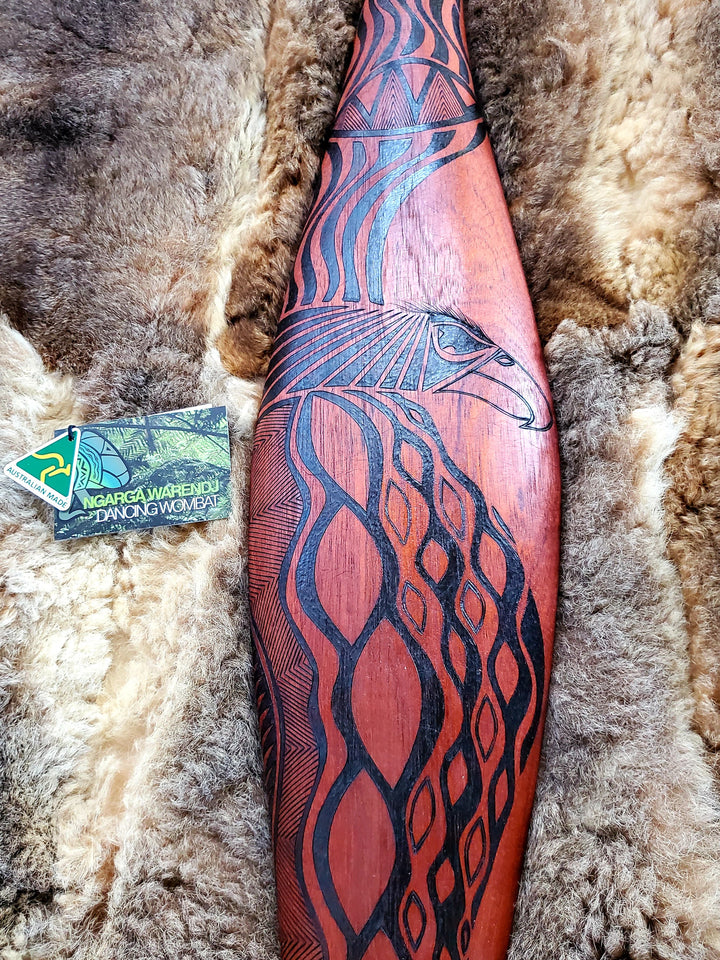Parrying Malgarr - Large Wide with Bunjil the Wedge Tailed Eagle Design.    Traditionally malgarr ( shields ) were used with liyangayil (fighting clubs) for hand to hand combat with our enemies.  I have replicated the shape of these shields in my artwork.  Hand crafted in Australia from Australian Red Cedar timber.  All artefacts come with an information card.  The card has information about the artist, artefact and design.  All designs are based on traditional Aboriginal symbols from South East Australia.