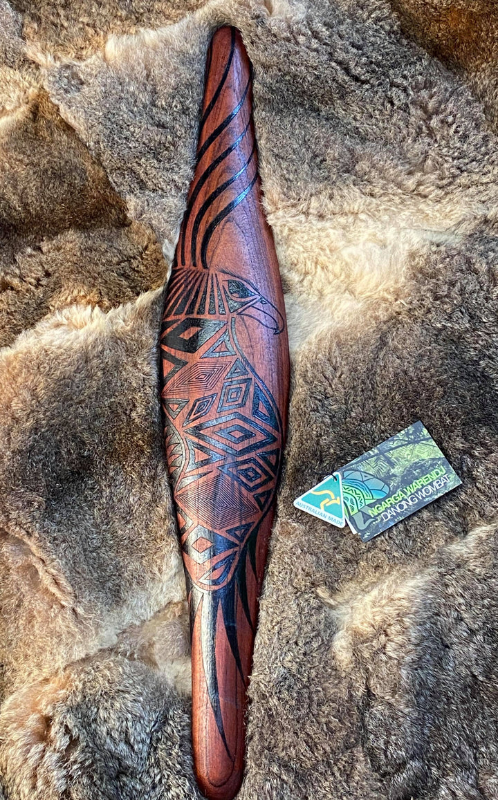 Medium Parrying Malgarr with Bunjil the Wedge Tailed Eagle Design. Traditionally malgarr ( shields ) were used with liyangayil (fighting clubs) for hand to hand combat with our enemies. I have replicated the shape of these shields in my artwork. Hand crafted in Australia from Australian Red Cedar timber. All artefacts come with an information card. The card has information aboutthe artist, artefact and design. All designs are based on traditional Aboriginal symbols from South East Australia.