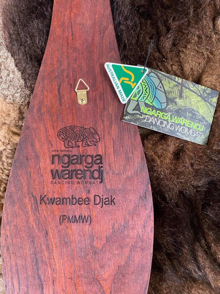 Traditionally malgarr ( shields ) were used with liyangayil ( fighting clubs) for hand to hand combat with our enemies. I have replicated the shape ofthese shields in my artwork. The Kwambee djak or common tree fern was used as a staple food by our old people during the Warendj (wombat season) or cooler months. Handcrafted in Australia from Australian Red Cedar by Mick Harding Ngarga Warendj Dancing Wombat