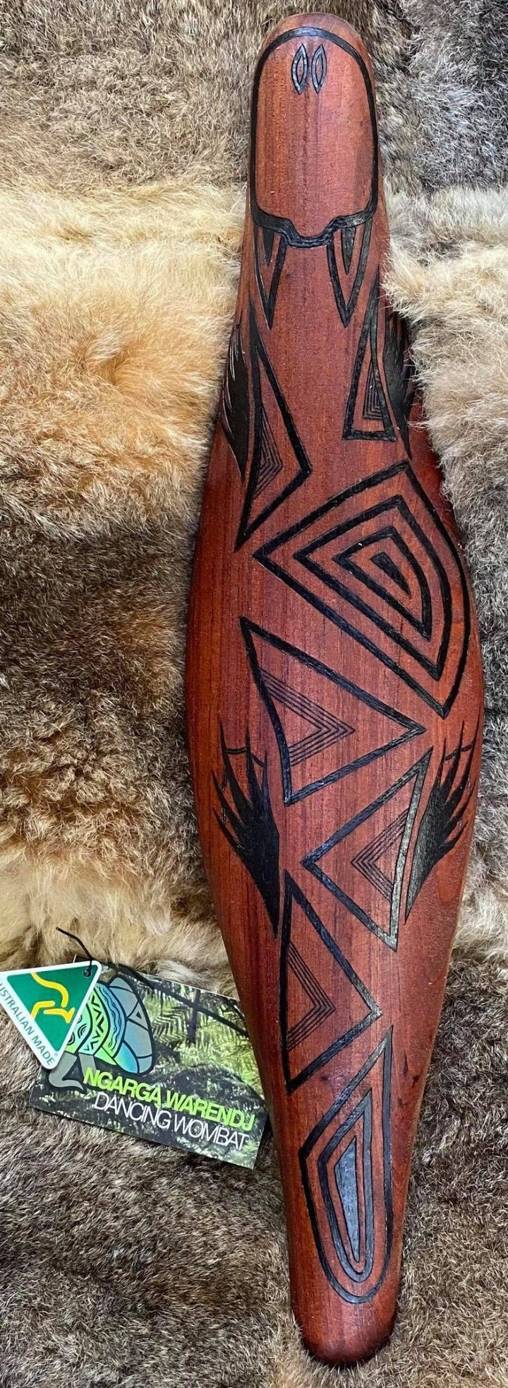 Ngarga Warendj Dancing Wombat Parrying Malgarr Shield with Budja the Platypus Design. Hand crafted in Australia from Australian Red Cedar timber. All artefacts come with an information card. The card has information about the artist, artefact and design. All designs are based on traditional symbols from South East Australia. Mick Harding