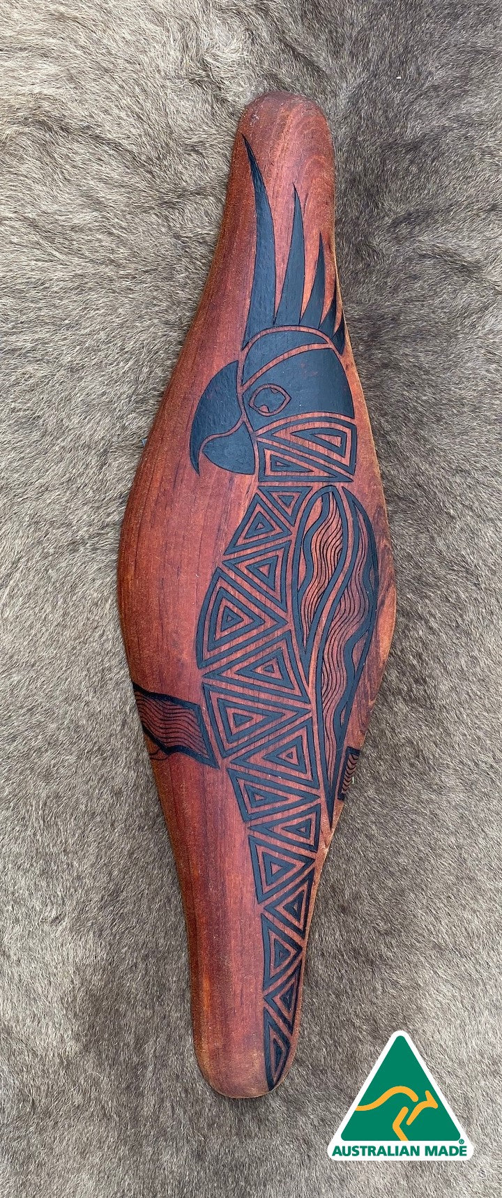 Parrying Malgarr Shield with Gaan the Cockatoo Design.    Hand crafted in Australia from Australian Red Cedar timber. All artefacts come with an information card.   The card has information about the artist, artefact and design.   All designs are based on traditional symbols from South East Australia.