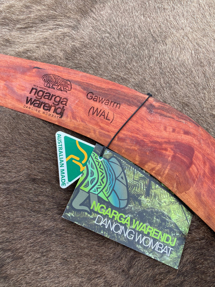 Large Gawarrn the Echidna Wangim / Boomerang. Made from Redgum timber.  Hand Crafted in Australia.  All artefacts come with an information card.  The card has information about the artist, artefact and design. All our wangim are made from timber collected from tree roots or branches that have a natural bend. All designs are based on traditional symbols from South East Australia