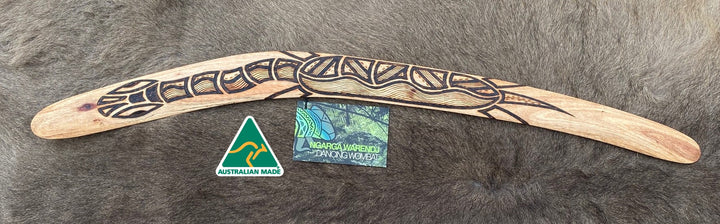 Large BareBin Buk the Turtle  Wangim / Boomerang. Made from Stringybark  timber.  Hand Crafted in Australia.  All artefacts come with an information card.  The card has information about the artist, artefact and design. All our wangim are made from timber collected from tree roots or branches that have a natural bend. All designs are based on traditional symbols from South East Australia