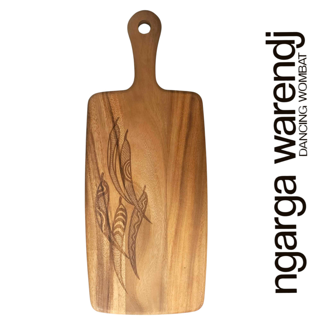 Wooden cutting board with engraved design on a white background, featuring the brand 'ngarga warendj'.