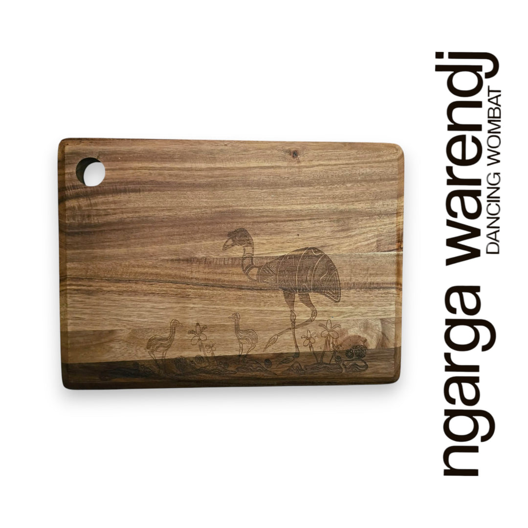 Wooden cutting board with engraved design on a white background, featuring the brand 'ngarga warendj'.