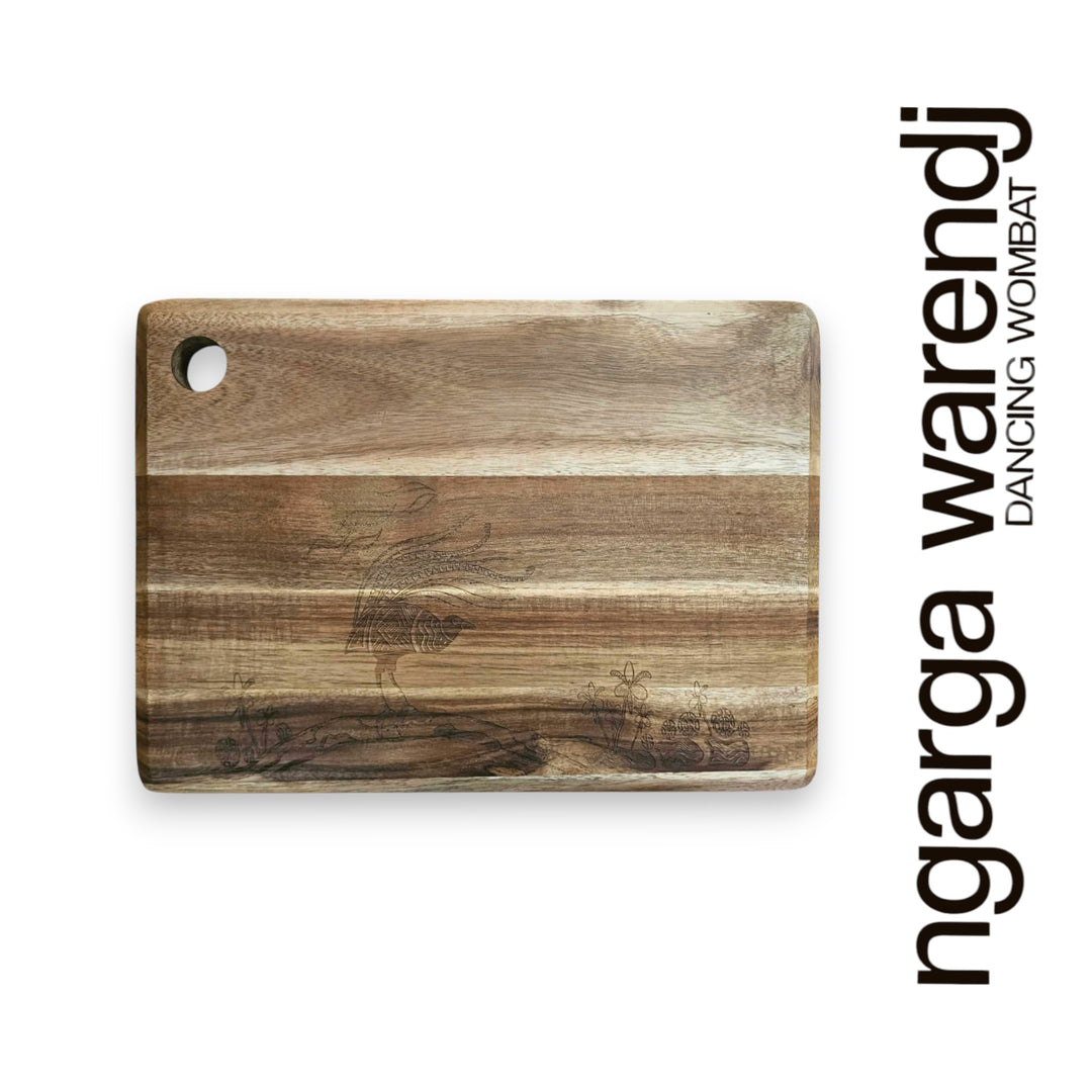 Wooden cutting board with engraved design on a white background, featuring the brand 'ngarga wardenj'.