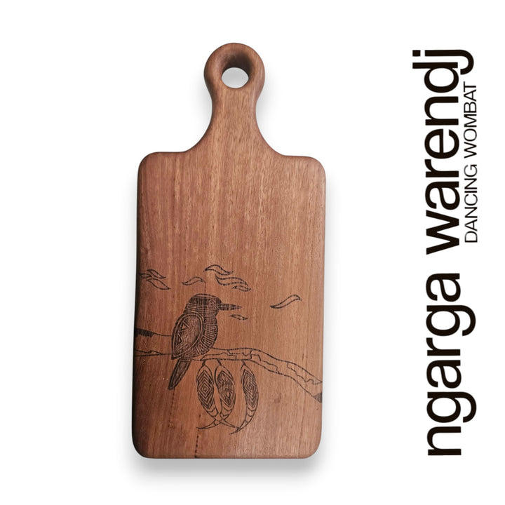 Wooden cutting board with bird design on a white background, featuring the brand 'ngarga warendj'.