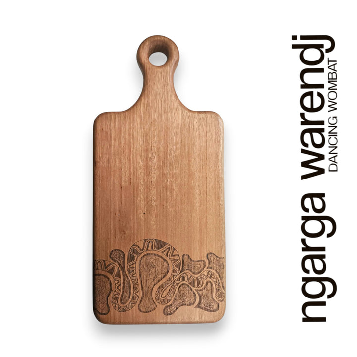 Wooden cutting board with embossed design on a white background, featuring the brand 'ngarga warendj'.