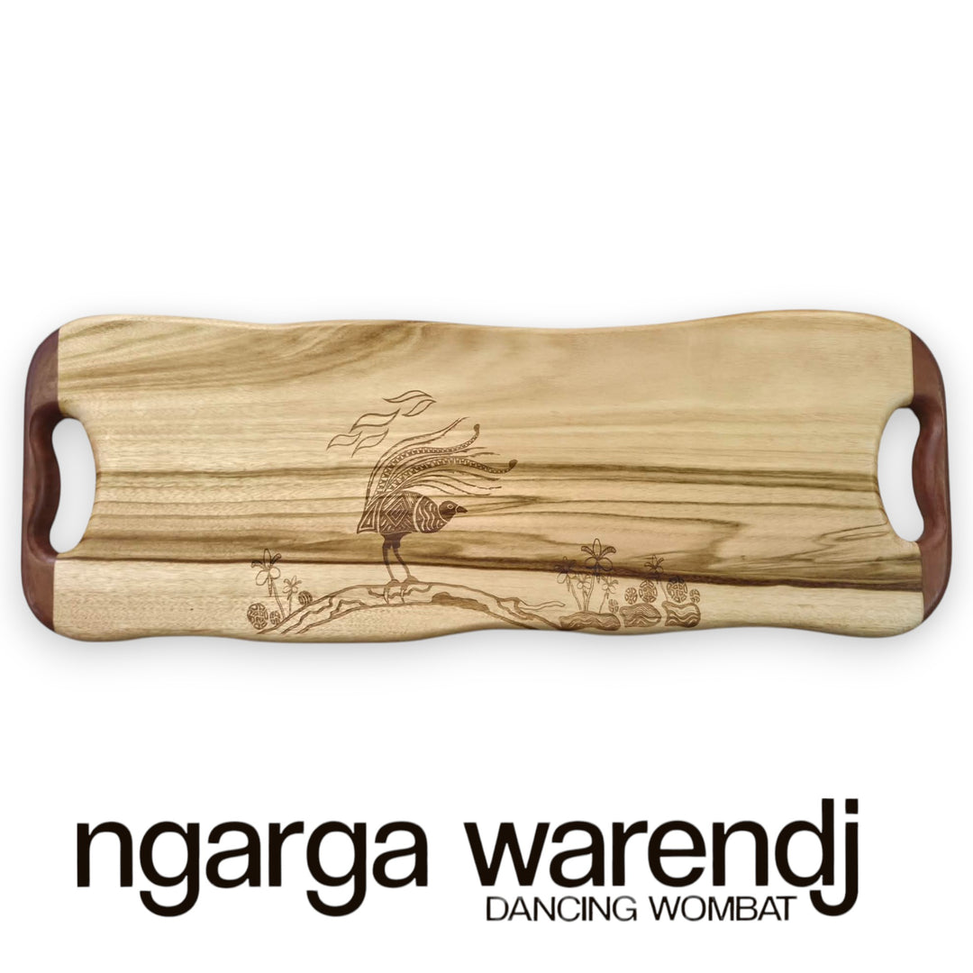 Wooden cutting board with engraved design on a white background, featuring the brand 'ngarga warendj'.