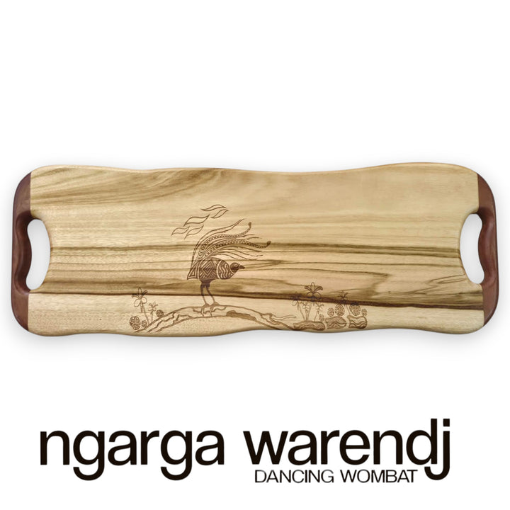 Wooden cutting board with engraved design on a white background, featuring the brand 'ngarga warendj'.