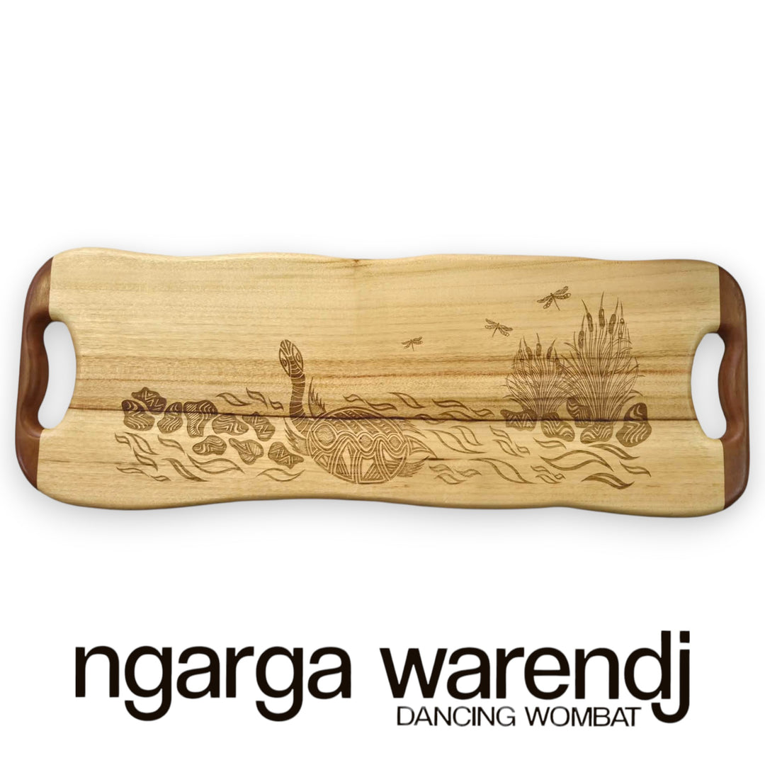 Wooden cutting board with laser engraving of a kangaroo and emu, branded 'ngarga warendj'.
