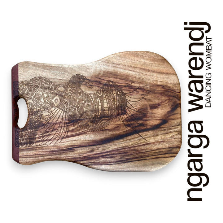 Wooden cutting board with a eagle design and 'ngarga warendj' branding on a white background