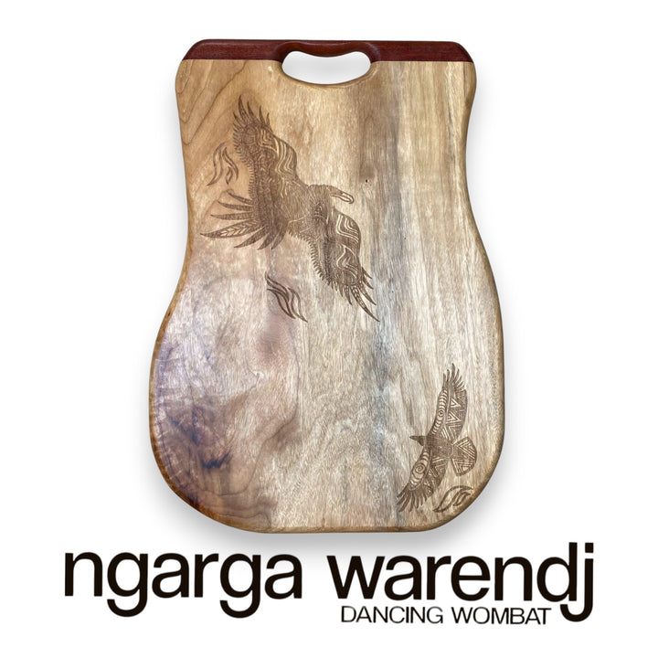 Wooden product with engraved designs on a white background, featuring the brand 'ngarga warendj'.
