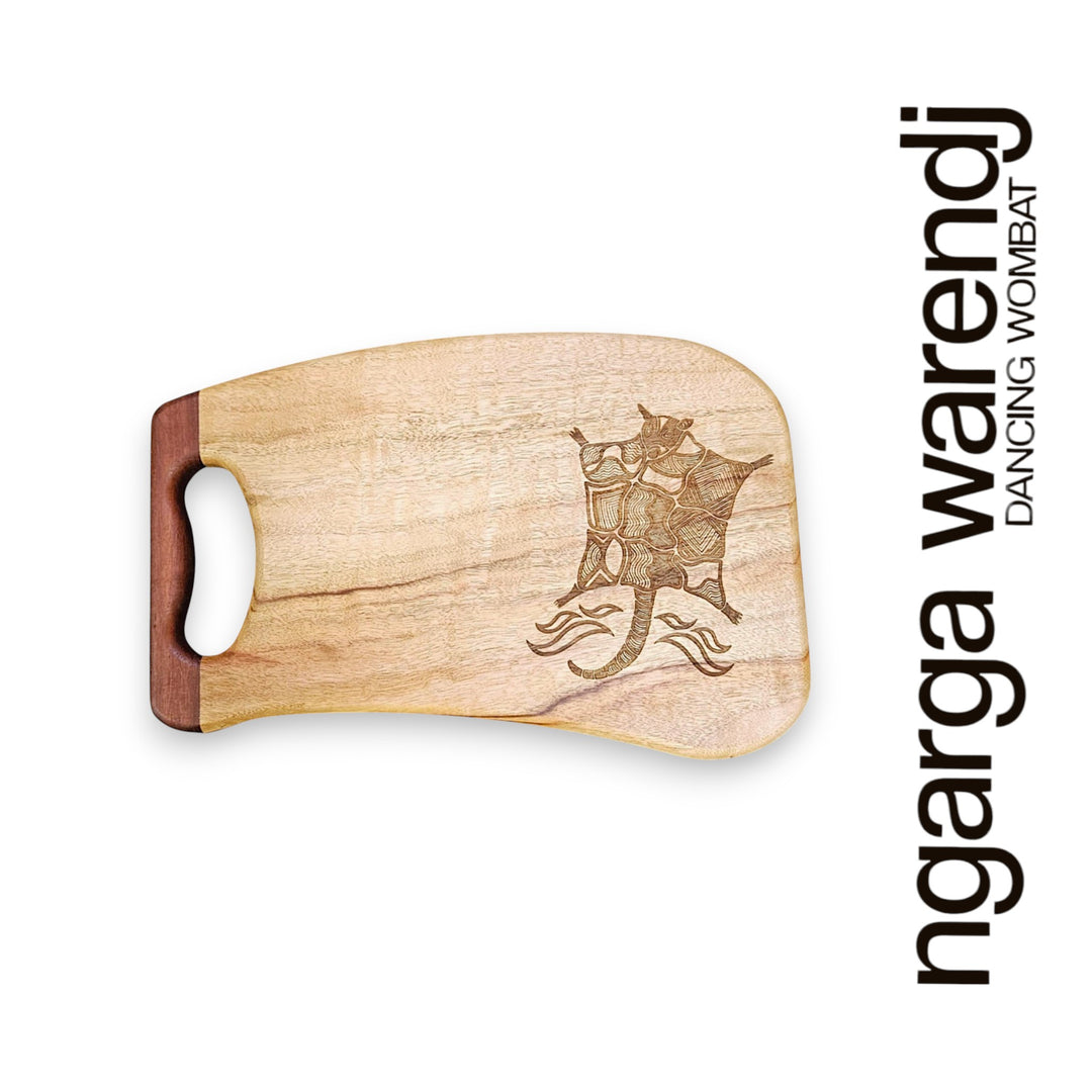 Wooden cutting board with laser engraving on a white background, featuring the brand 'ngarga warendj'.
