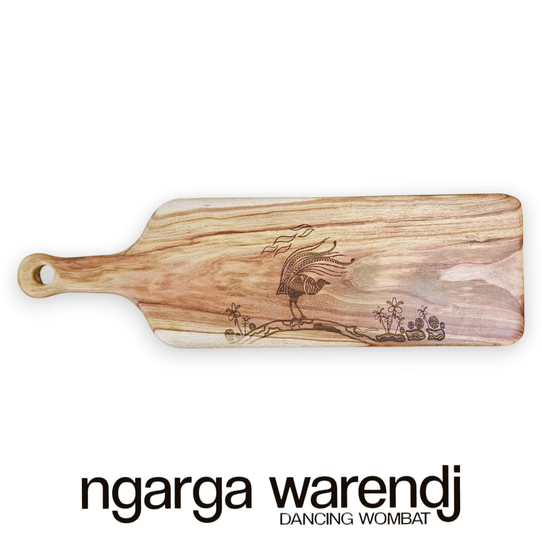 Wooden cutting board with engraved design on a white background, featuring the brand 'ngarga warendj'.