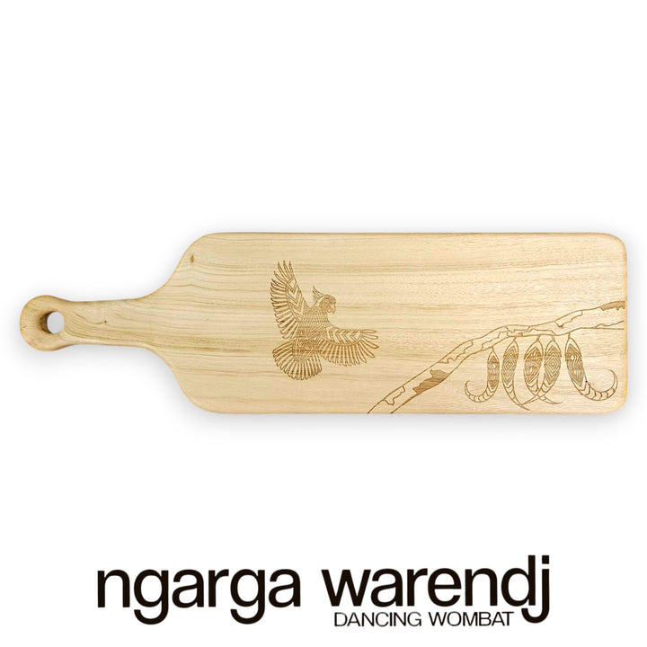 Wooden cutting board with engraved design on a white background, featuring the brand 'ngarga warendj'.