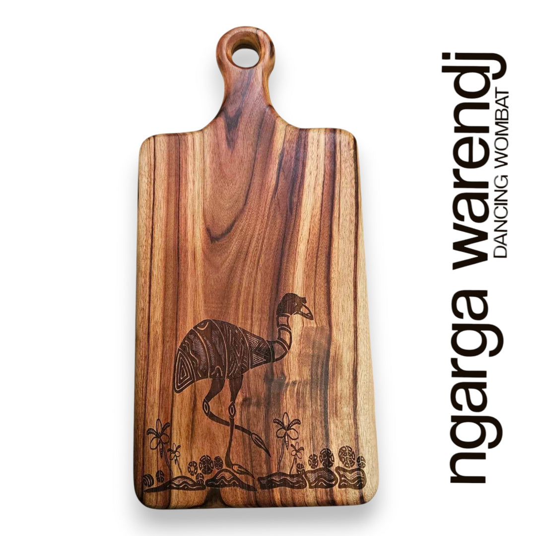 Wooden cutting board with emu design and 'ngarga warendj' branding on a white background