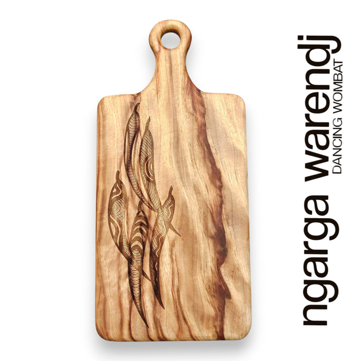 Wooden cutting board with engraved design on a white background, featuring the brand 'ngarga warendj'.