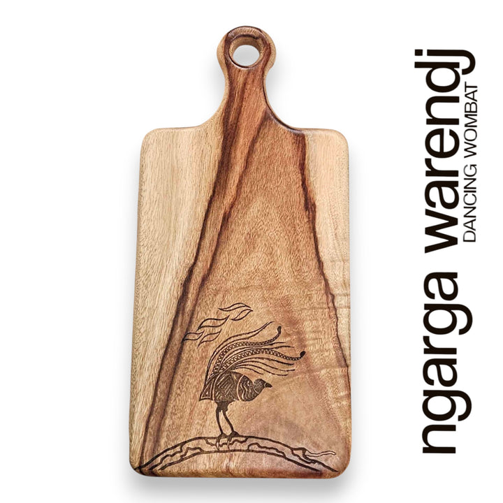 Wooden cutting board with a laser-engraved design on a white background, featuring the brand 'ngarga wardenji'.