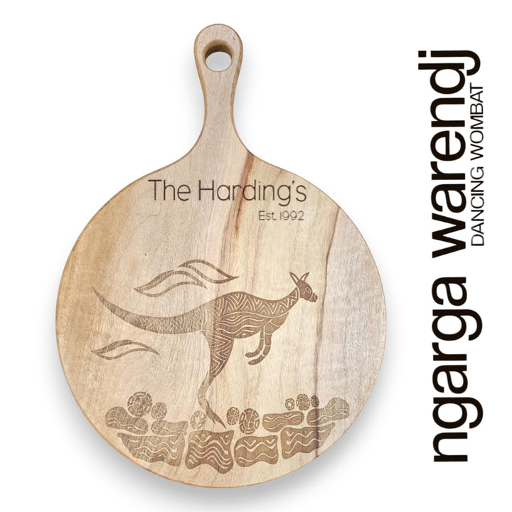 Wooden cutting board with kangaroo engraving and 'The Hardings' and Ngarga Warendj branding on a white background.