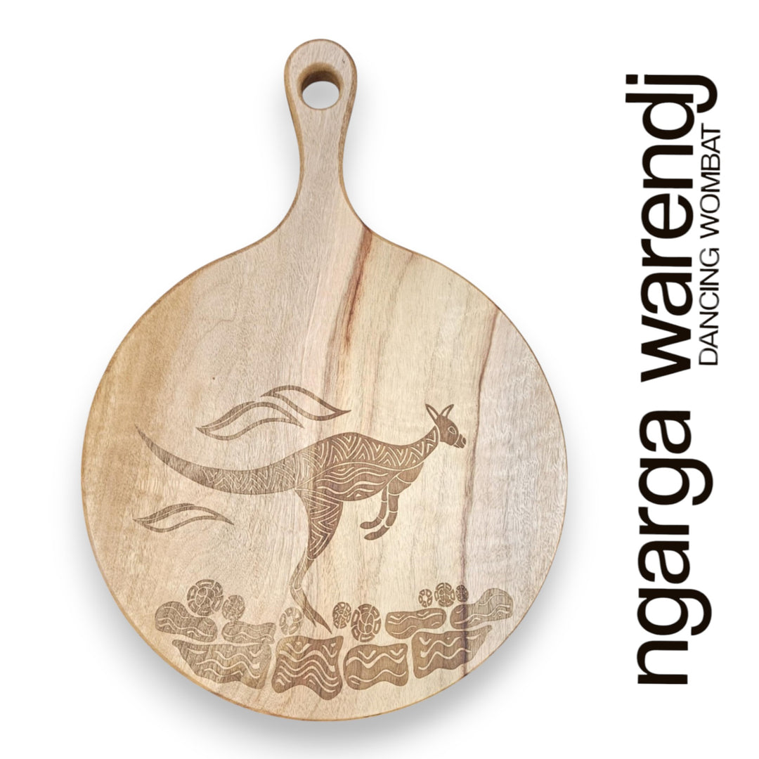 Wooden cutting board with kangaroo engraving and 'ngarga warendj' branding on a white background