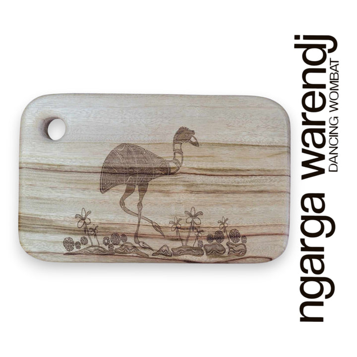 Wooden cutting board with a laser-engraved design of a dancing wombat, branded 'ngarga warendj'.