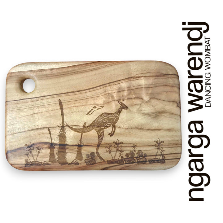 Wooden cutting board with laser-engraved designs on a white background, featuring the brand 'ngarga warendj'.