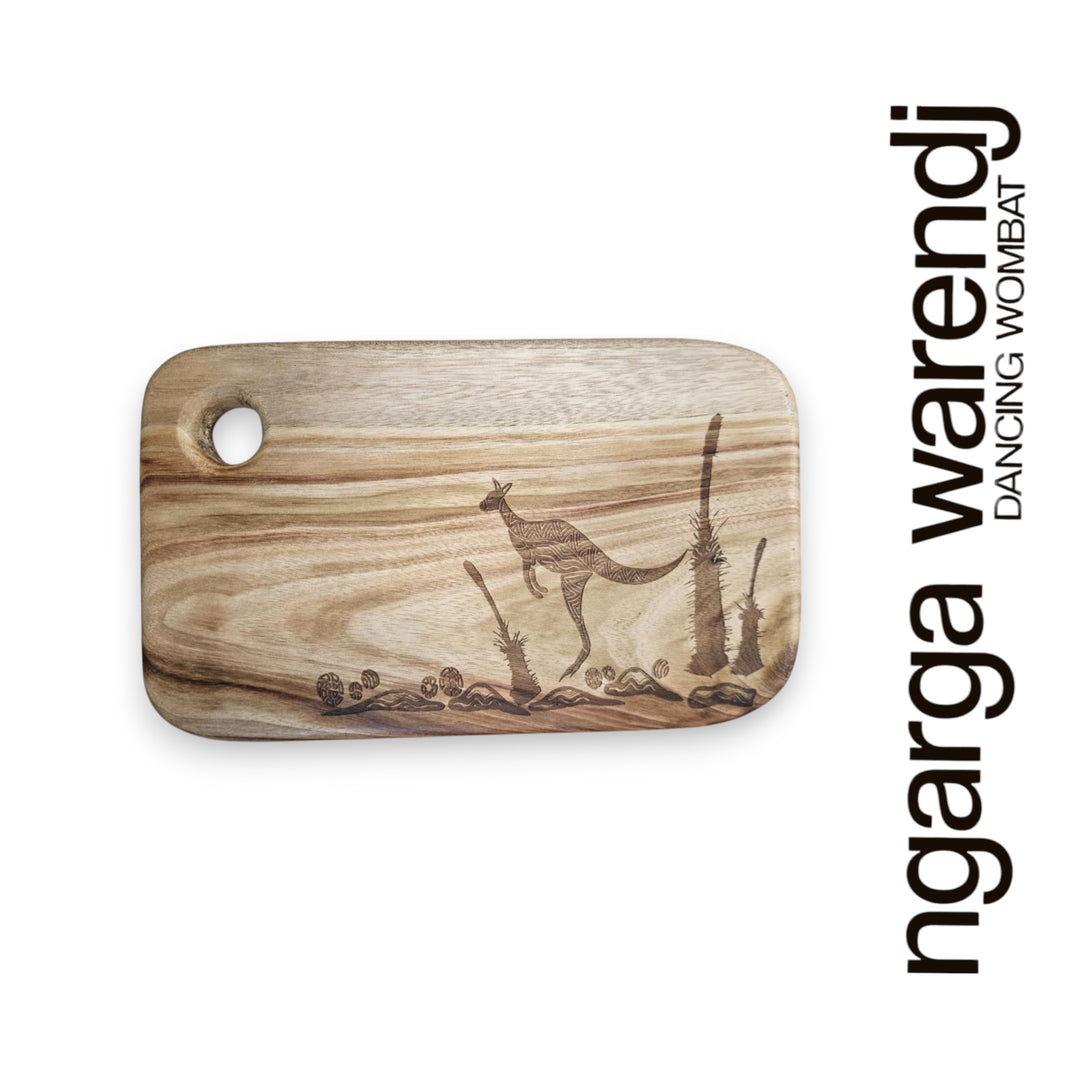 Wooden cutting board with kangaroo design and 'ngarga warendj' branding on a white background