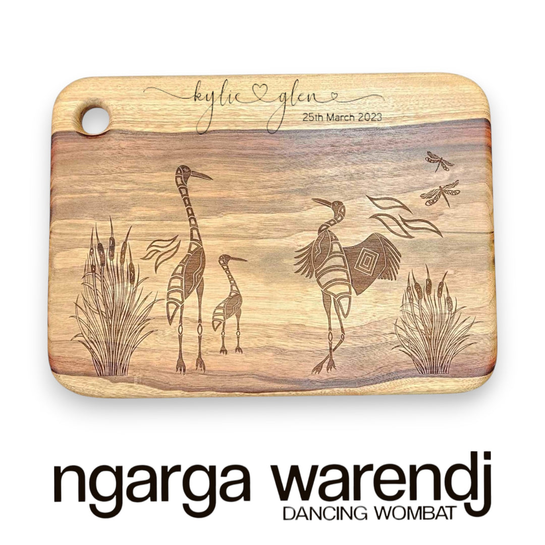 camphor laurel board with brolgas design by ngarga warendj