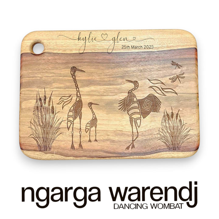 camphor laurel board with brolgas design by ngarga warendj