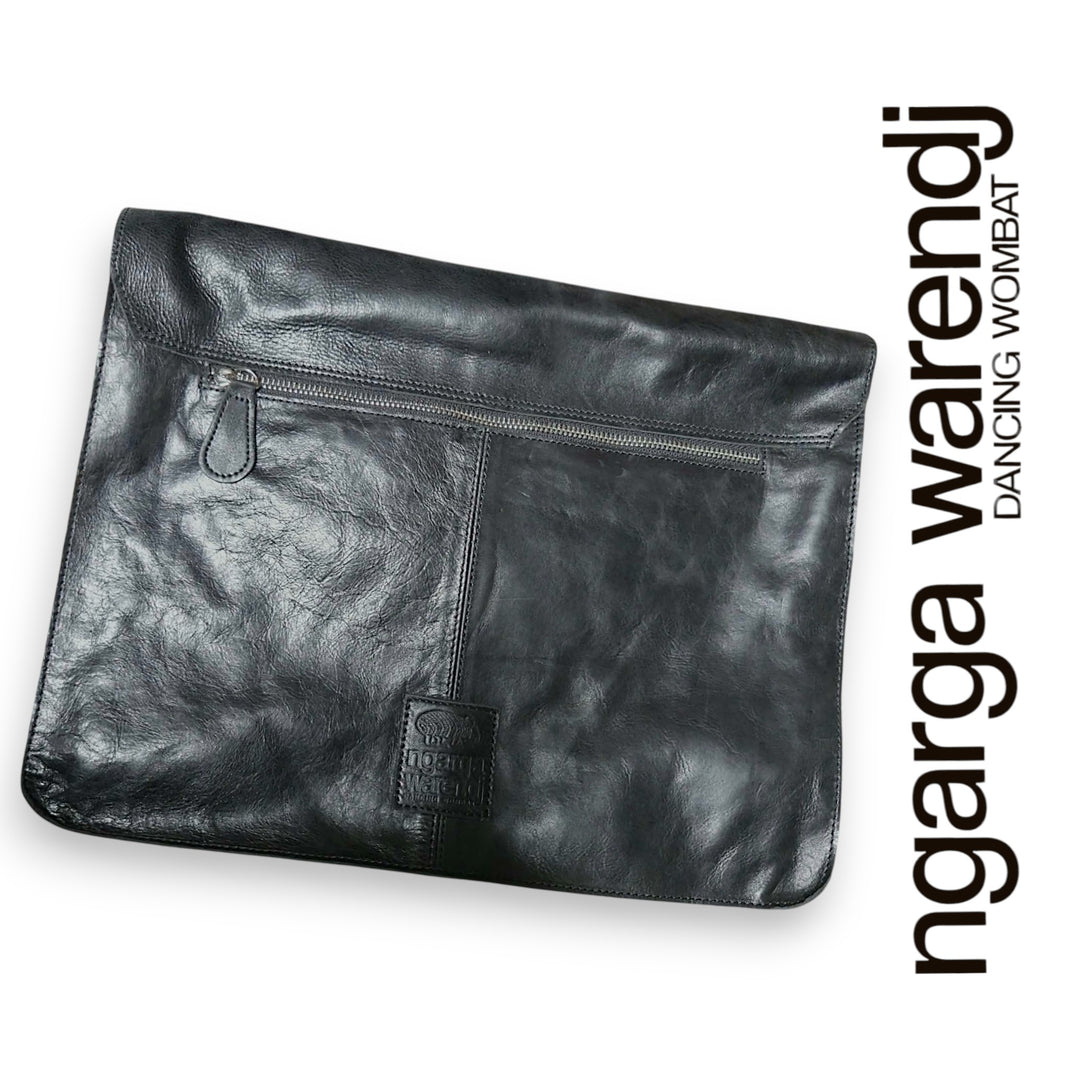 Black leather computer bag with a visible brand name on a white background