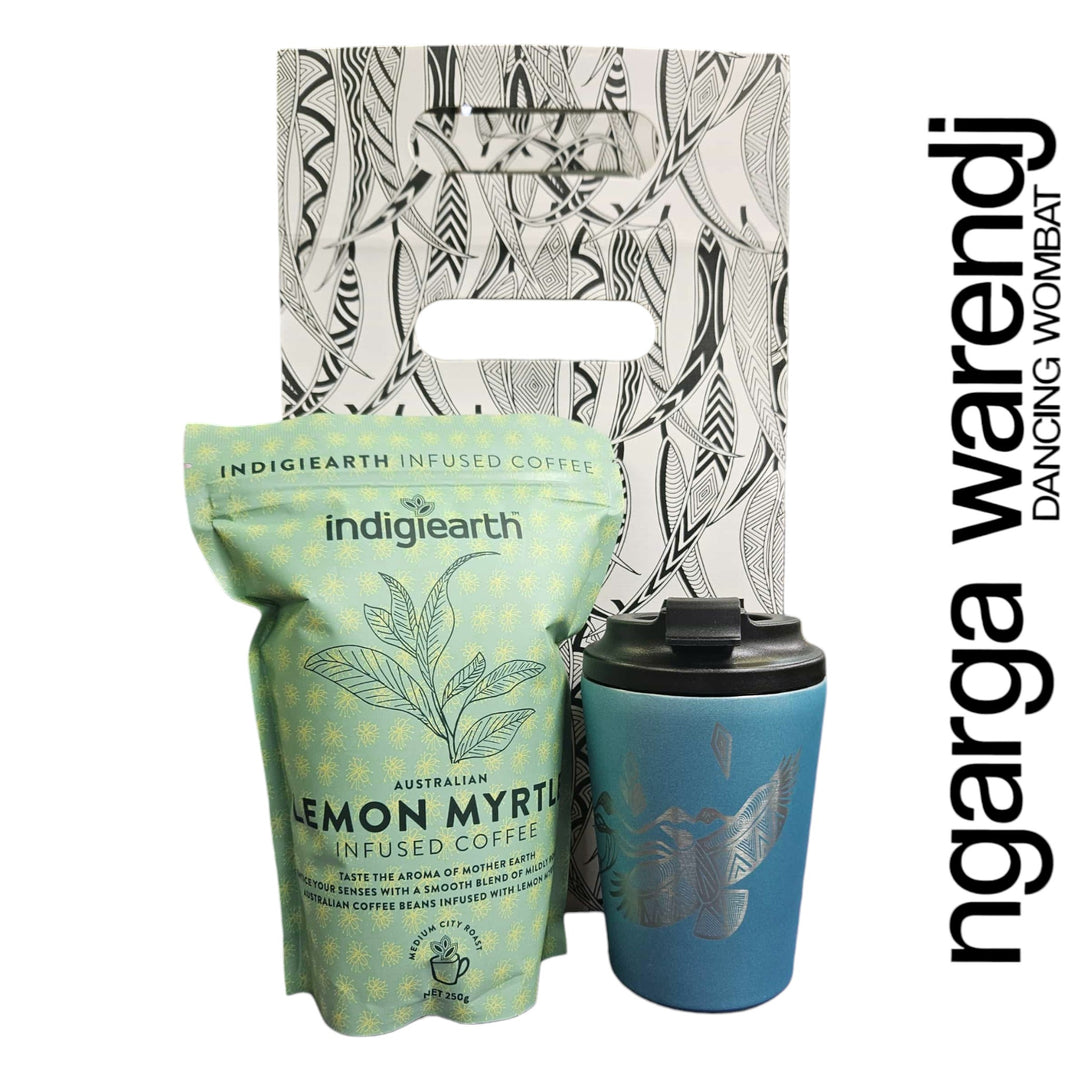 Indigiearth lemon myrtle coffee package with a blue reusable cup on a white background, featuring the ngarga wardenj brand.