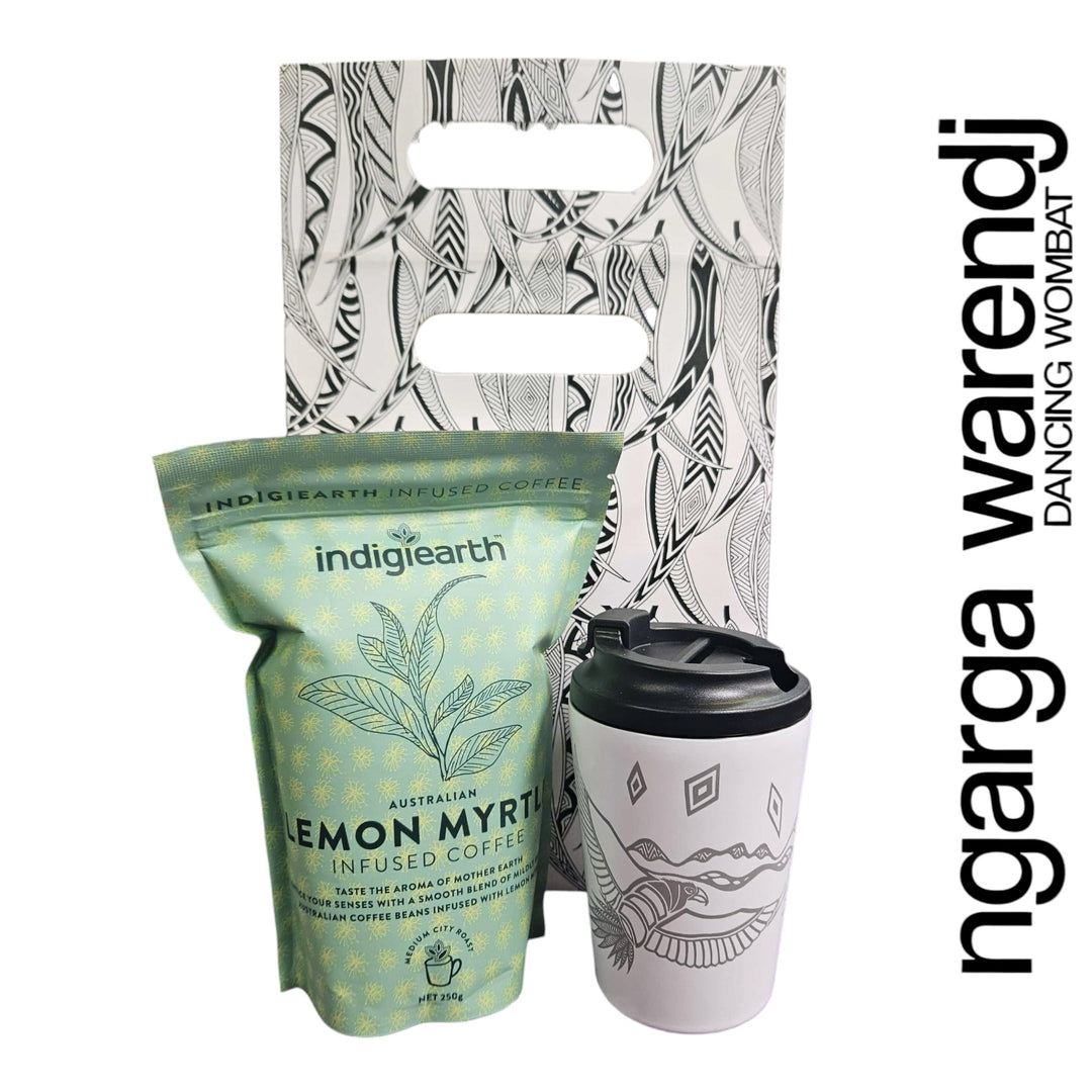 Indigearth lemon myrtle coffee package with a reusable mug and patterned bag on a white background.