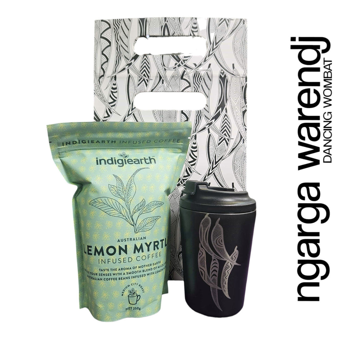 Indigiearth lemon myrtle infused coffee package with a black tumbler and decorative packaging on a white background.