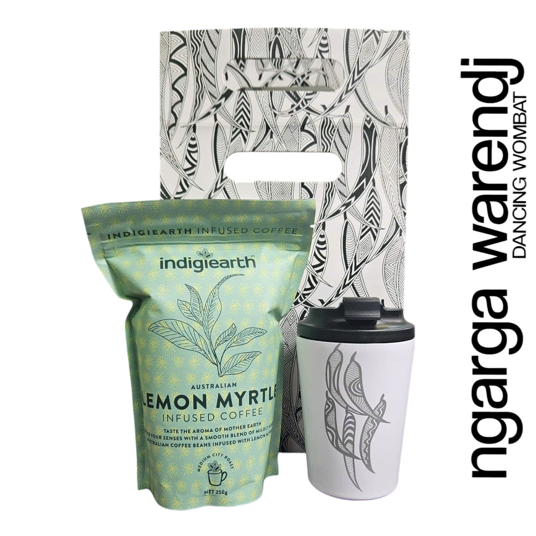 Indigearth lemon myrtle infused coffee package with a white tumbler featuring a design, on a white background with 'ngarga warden' branding.