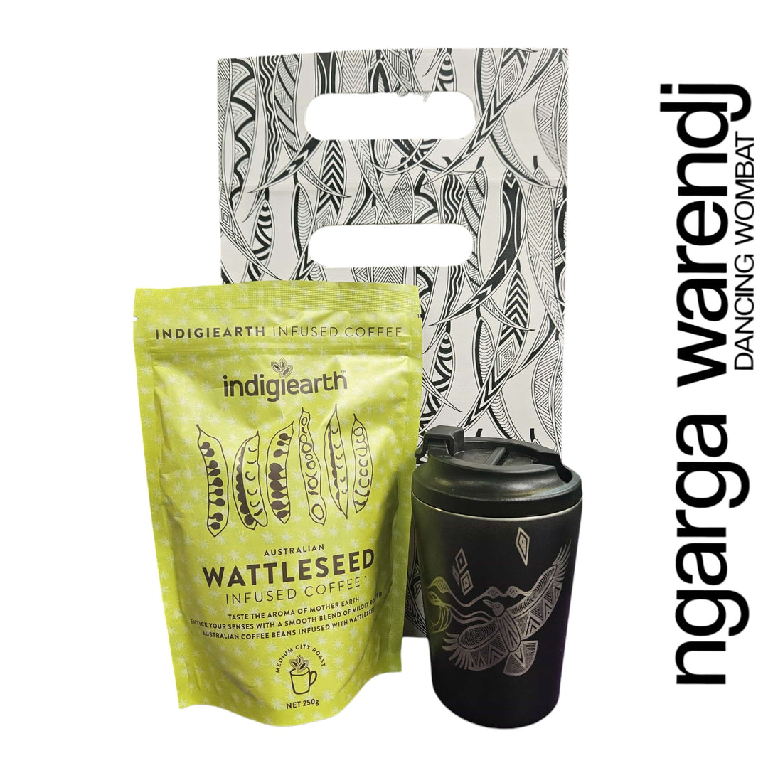 Indigiearth wattleseed infused coffee package with a black tumbler and branded bag on a white background.