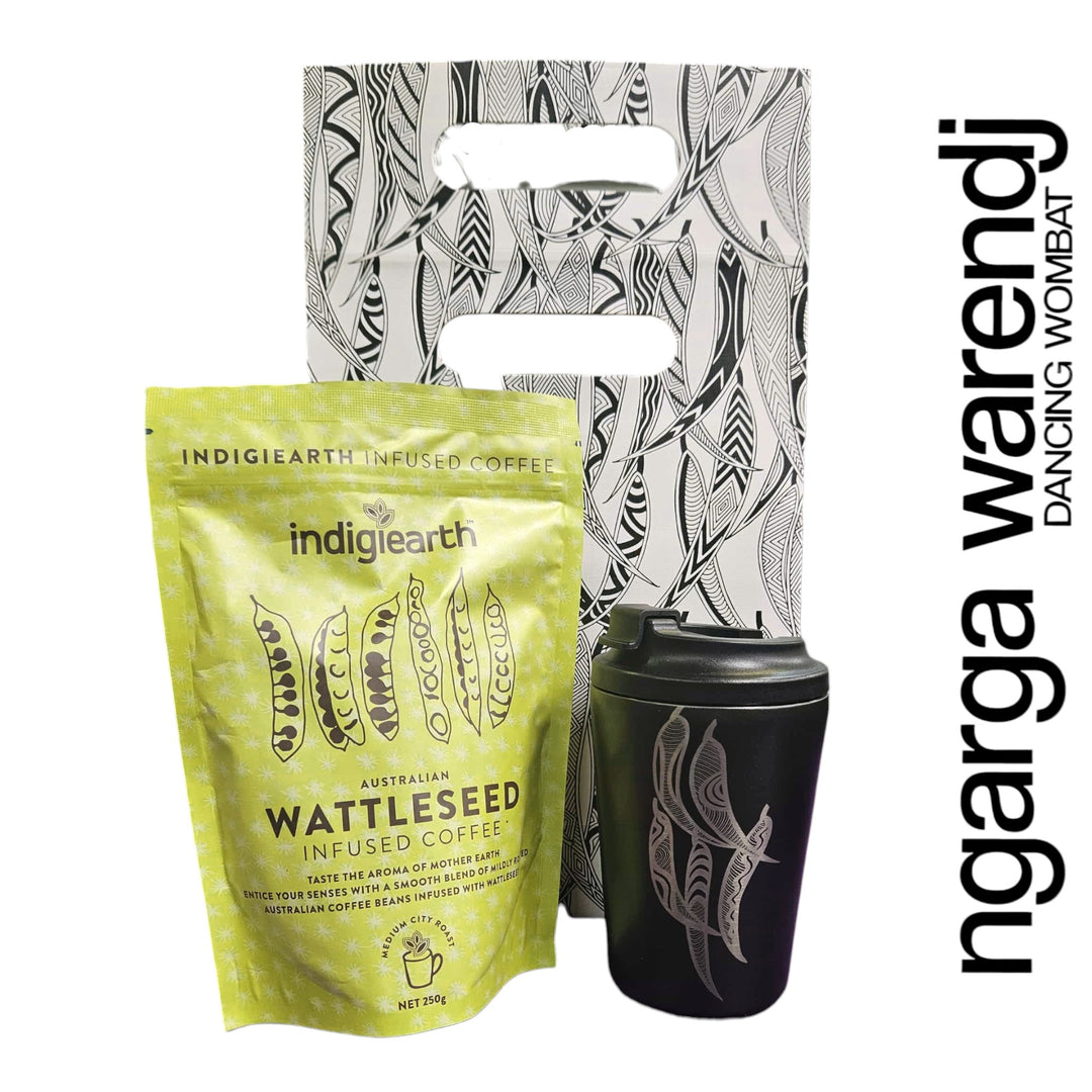 Indigiearth wattleseed infused coffee package with a black tumbler and a branded carrier bag on a white background.