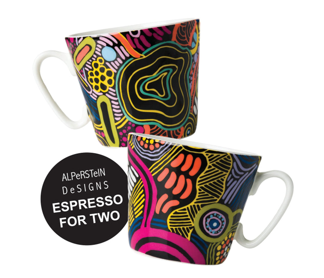 Two ceramic mugs with a vibrant, multicolored abstract pattern on a white background, featuring a black circular badge that reads 'ALPerStein Designs ESPRESSO FOR TWO'.