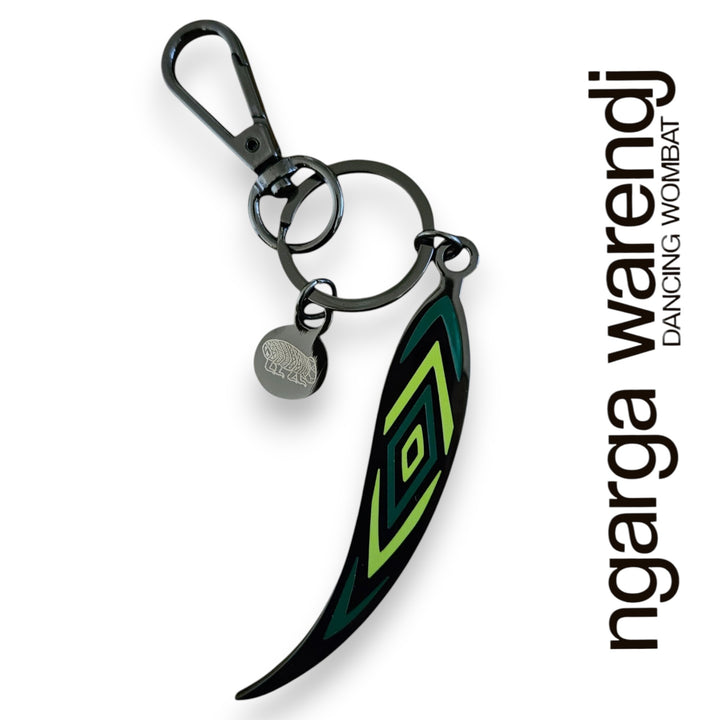 Keychain with green and black design on a white background, featuring the brand 'ngarga warendj'.