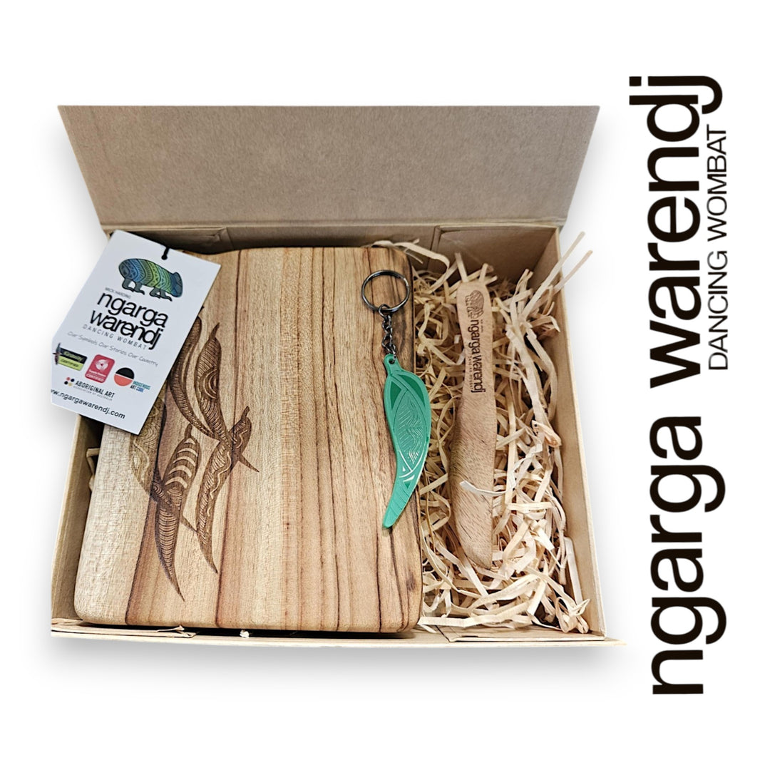 Wooden product with board, spreader and keychain in a box, featuring 'ngarga warendj' branding.