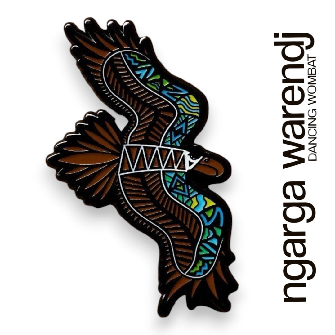 Decorative brooch of a eagle bird with colorful patterns on a white background, featuring the brand 'ngarga warendj'.