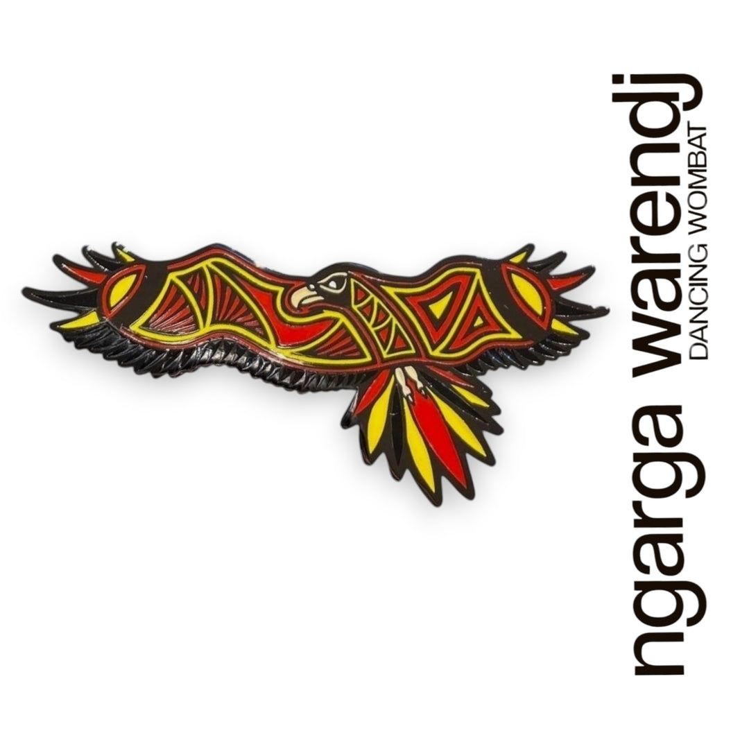Decorative pin with a stylized design on a white background, featuring the brand 'ngarga warendj'.