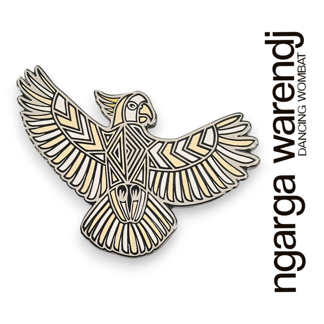 Decorative emblem of a bird with intricate patterns on a white background, featuring the brand 'ngarga warendj'.