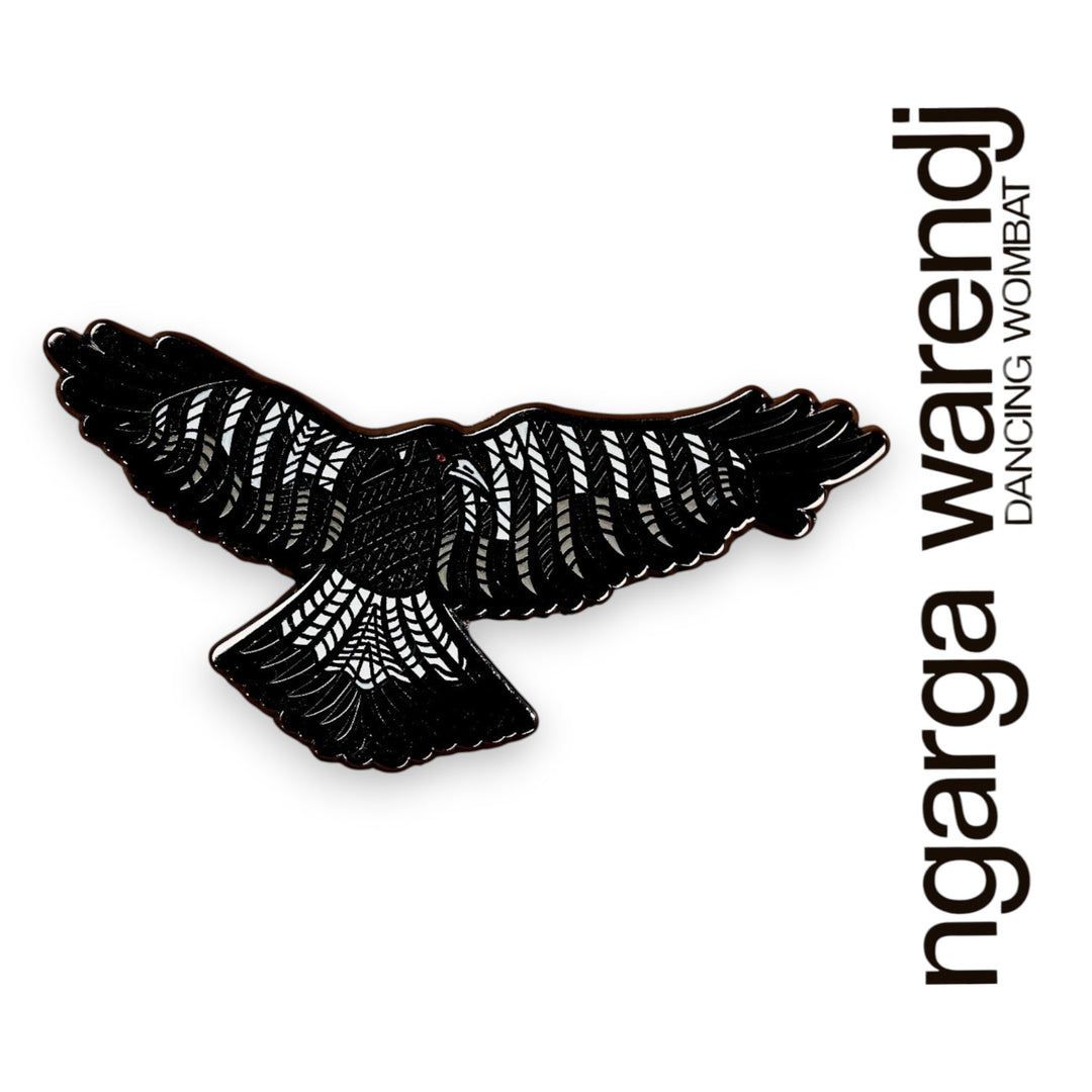 Black and white magpie bird with 'ngarga warendj' text on a white background