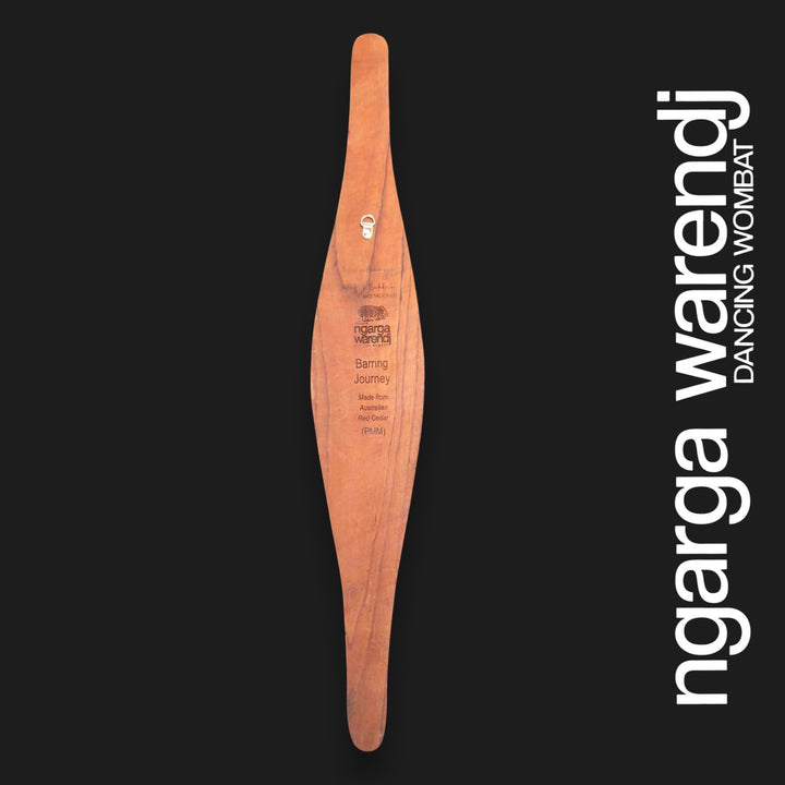 Back of medium Barring Track parrying shield showing red cedar grain, engraved Ngarga Warendj branding and metal wall hanger.
