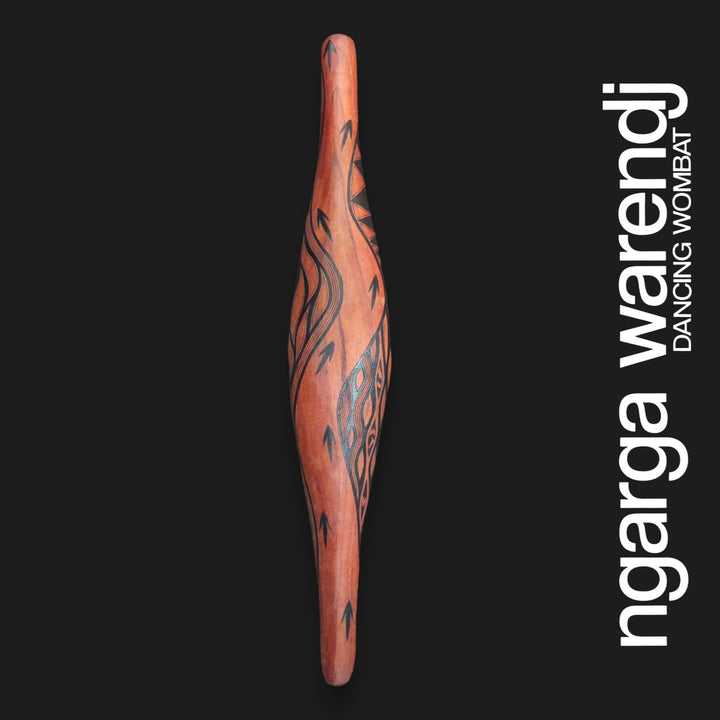 Front of medium red cedar parrying shield with Barring Track Design, featuring black track marks and curved linework.