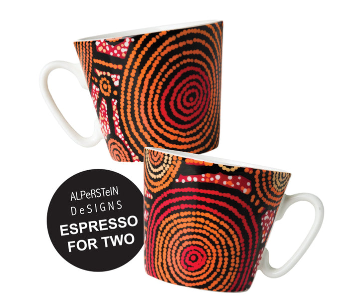 Two ceramic mugs with a black, orange, and red dot-art pattern, shown on a white background with a black circular badge that reads 'ALPerSTeln Designs ESPRESSO FOR TWO'.
